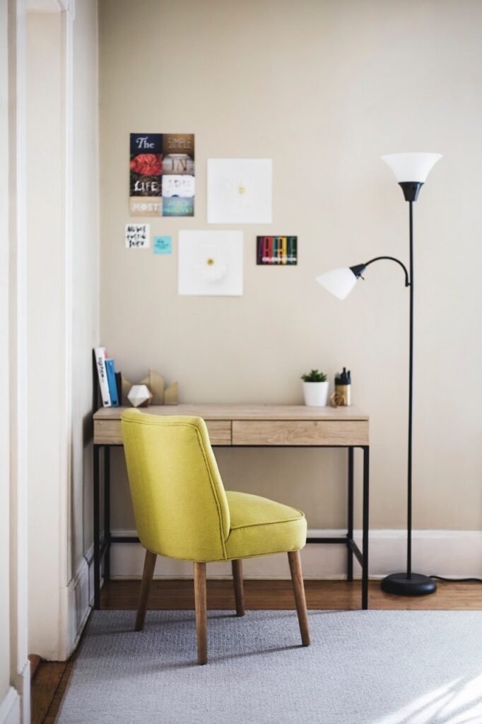 table, chair, desk, lamp, room, carpet, posters, picture stickers, chair, chair, desk, desk, desk, lamp, room, room, room, room, room